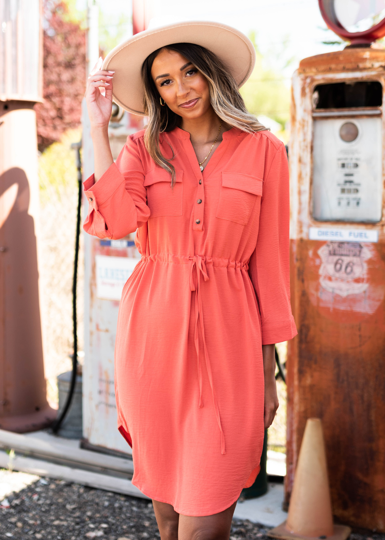 Terracotta dress with collar and buttons that ties at the waist 