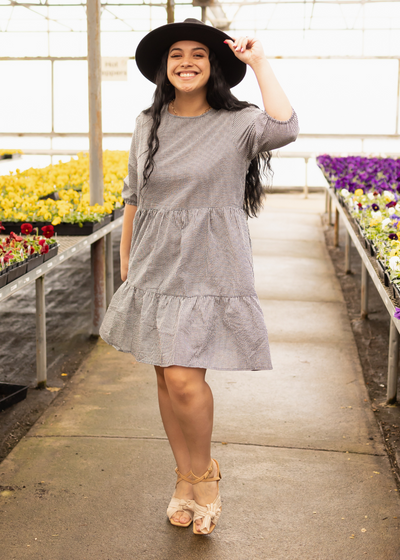 Knee length black dress with checker pattern