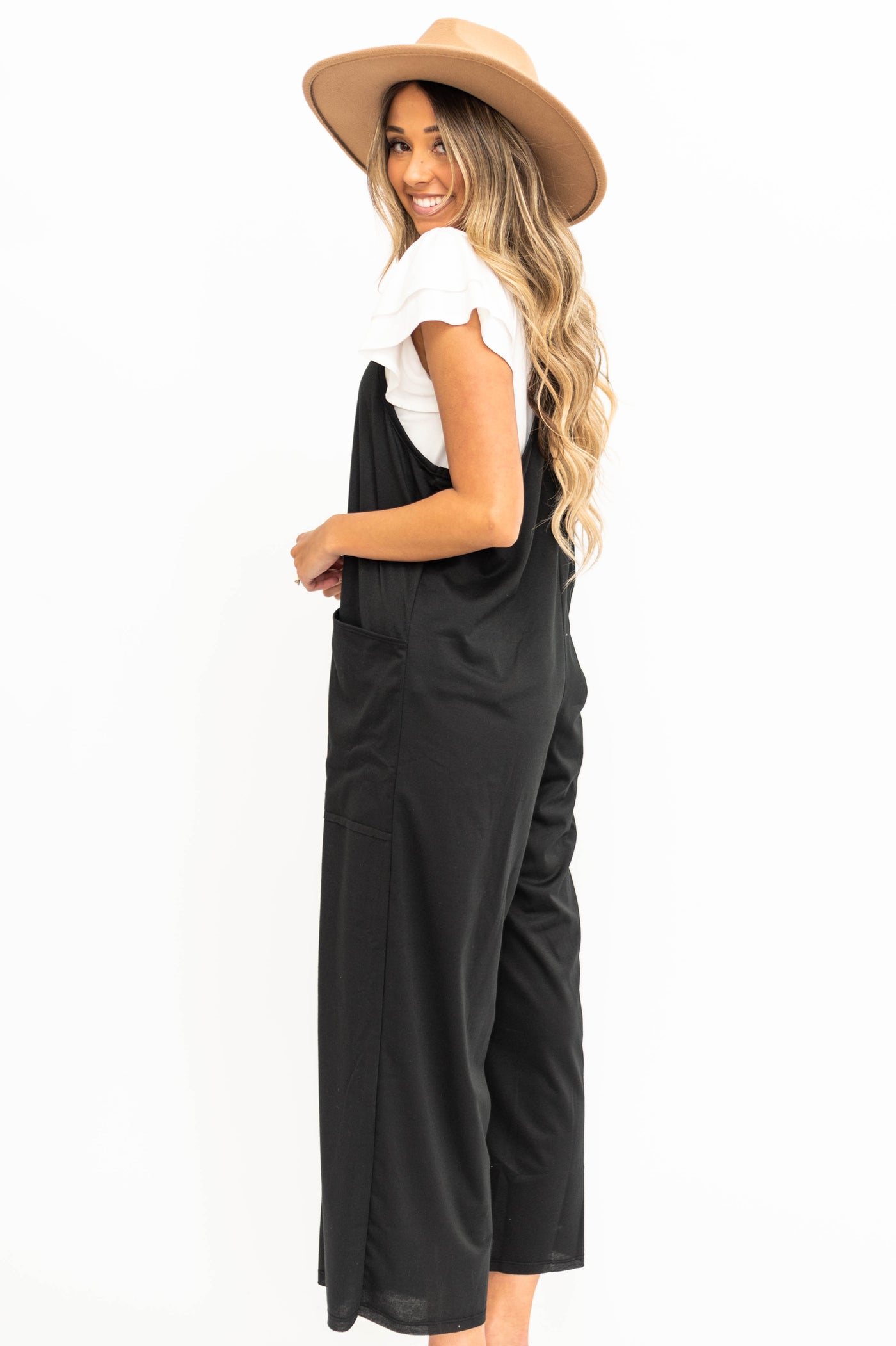 Side view of a wide leg black jumpsuit