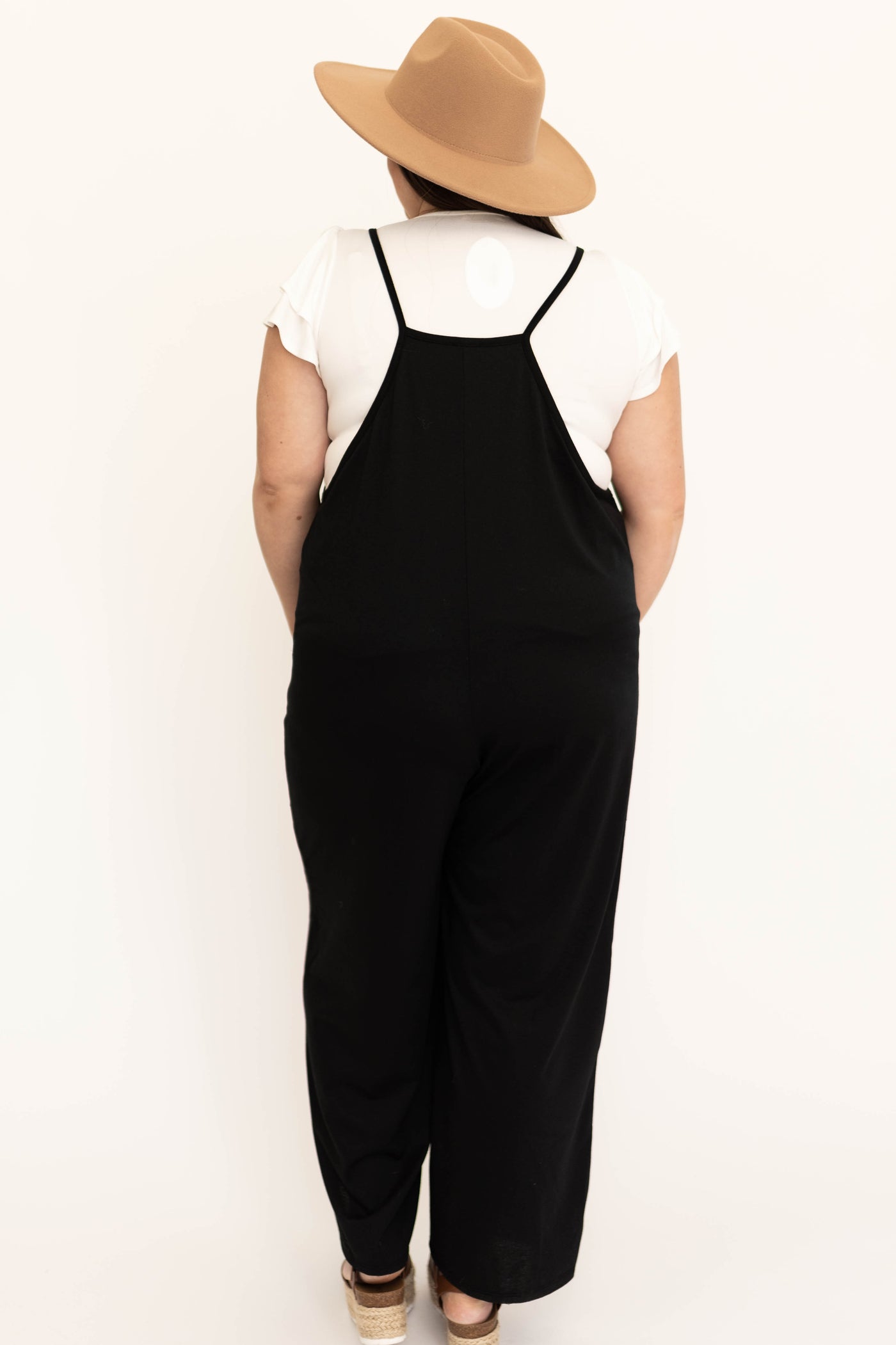 Plus size back view of a black jumpsuit