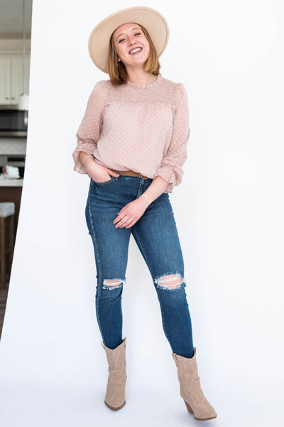 Dusty pink top with ruffle around the neck