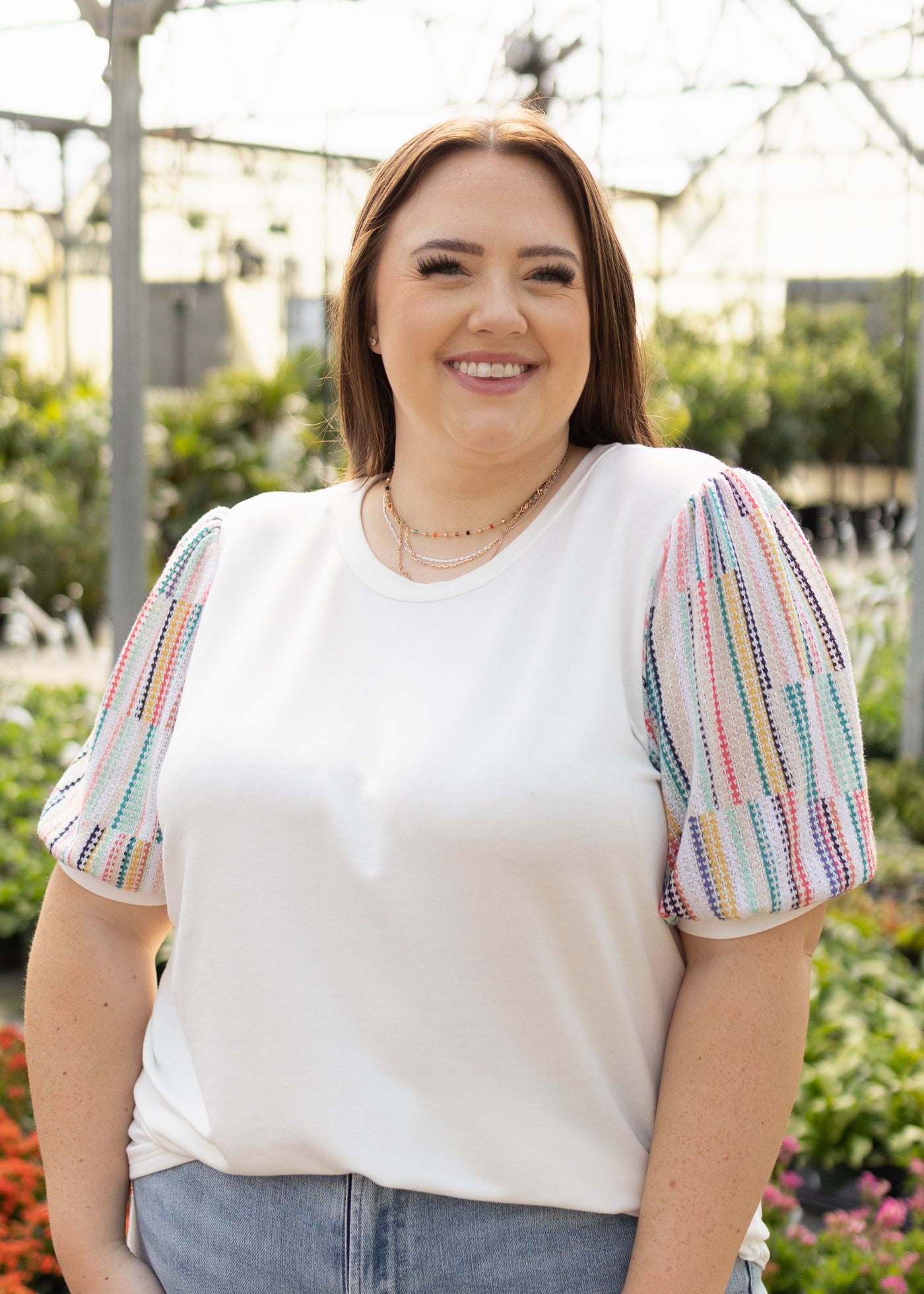 White top with short colorful sleeves and round neck