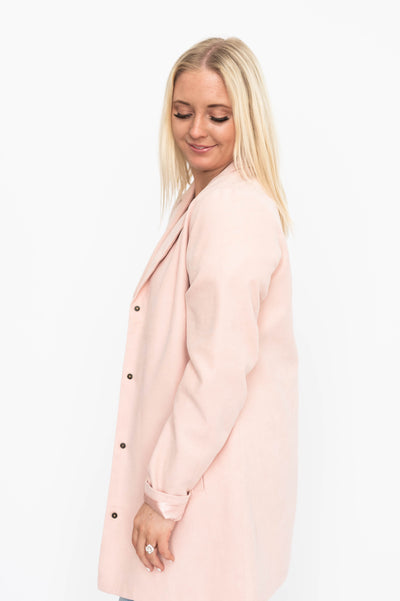 Side view of a blush blazer