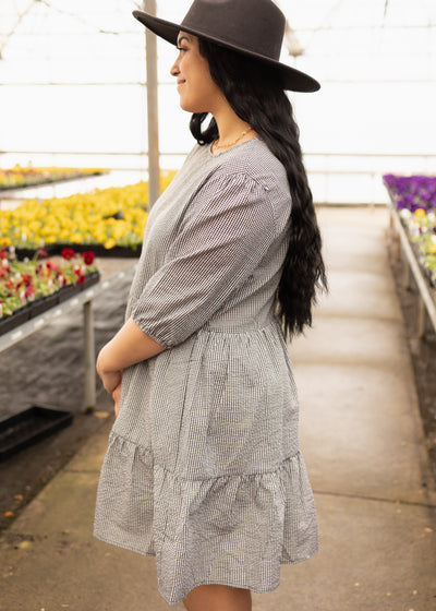 Side view of a short sleeve black dress